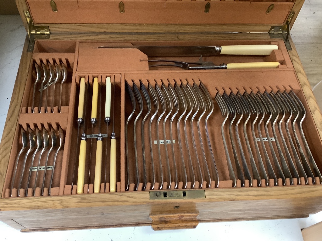 An oak cased plated part canteen of cutlery